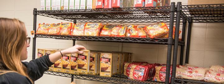 Student shopping at the food pantry facility.